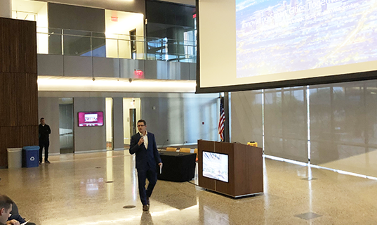 Chris Camacho provides opening remarks at the ASU Smart Region Summit, discussing innovation in the Greater Phoenix region