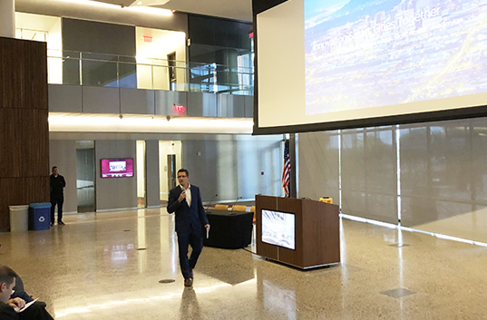 Chris Camacho provides opening remarks at the ASU Smart Region Summit, discussing innovation in the Greater Phoenix region