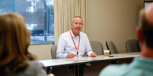 Honeywell Aerospace CEO Mike Madsen speaks in a conference room
