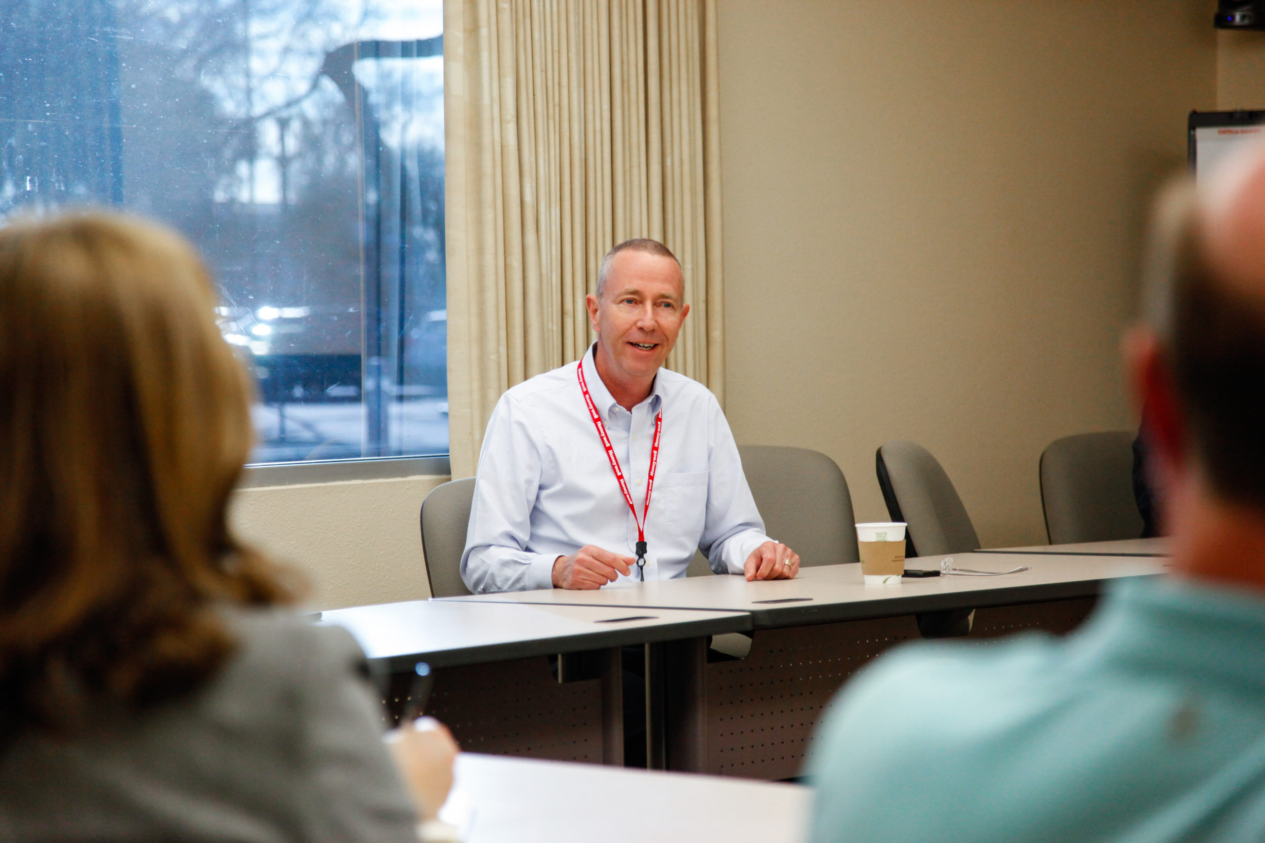 Honeywell Aerospace CEO Mike Madsen speaks in a conference room