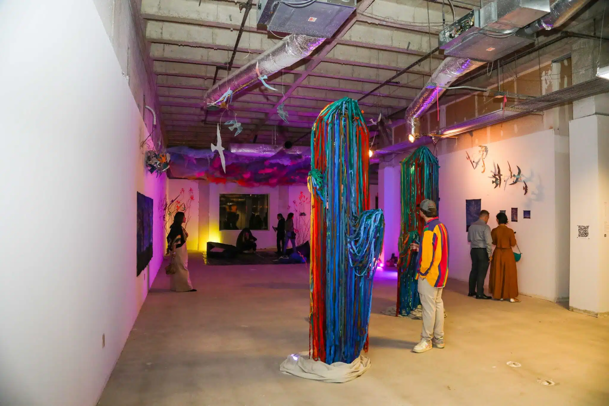 People viewing art at an art gala in Phoenix.