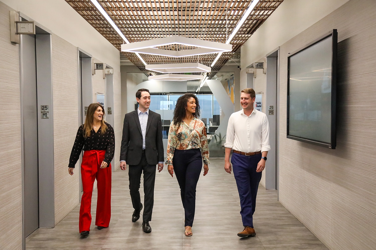 GPEC employees walk in office hallway