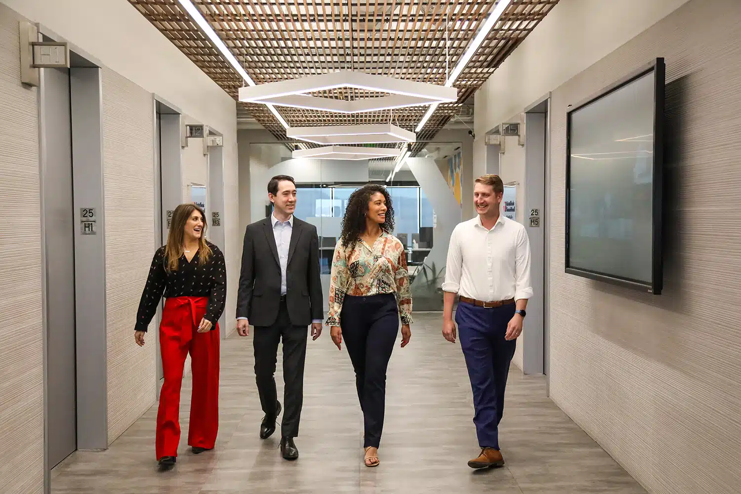 GPEC employees walk in office hallway