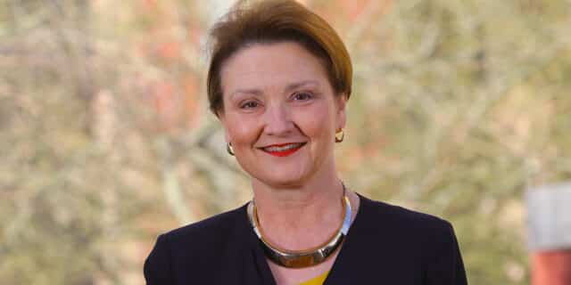 A woman poses for a portrait.