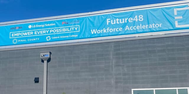 A blue banner on a commercial building showcases the Future48 Workforce Accelerator.