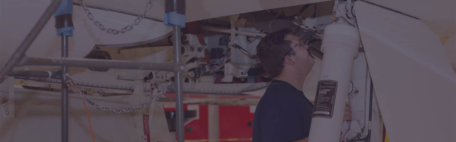 Airplane mechanic working.