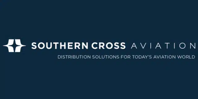A dark blue background with Southern Cross Aviation written, first two words in white and third word in light blue. The white company insignia is on the lefthand side and motto beneath.