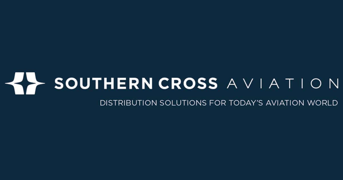 A dark blue background with Southern Cross Aviation written, first two words in white and third word in light blue. The white company insignia is on the lefthand side and motto beneath.